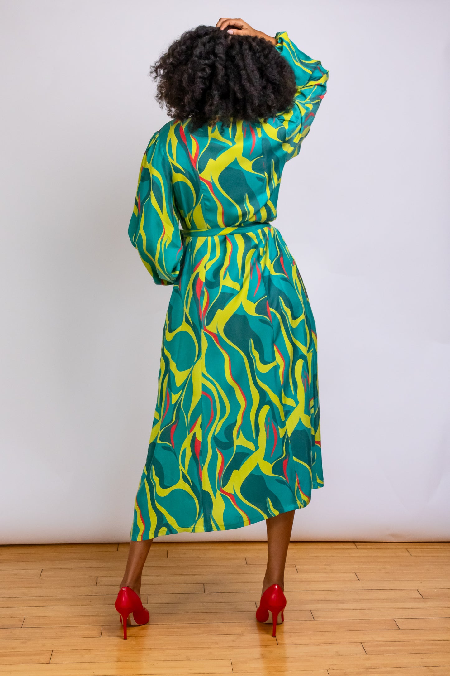 Back view of Denver Abstract Printed Midi-length Shirt Dress in green and chartreuse. Made for tall women but wearable as a maxi for women below 5'9".