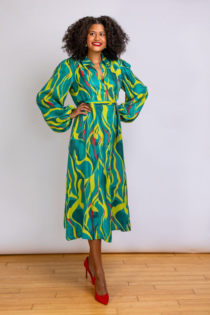 Model/Owner Robyn shows off the flow Cupro blend fabric of the Denver Abstract Printed Midi-length Shirt Dress in green and chartreuse.